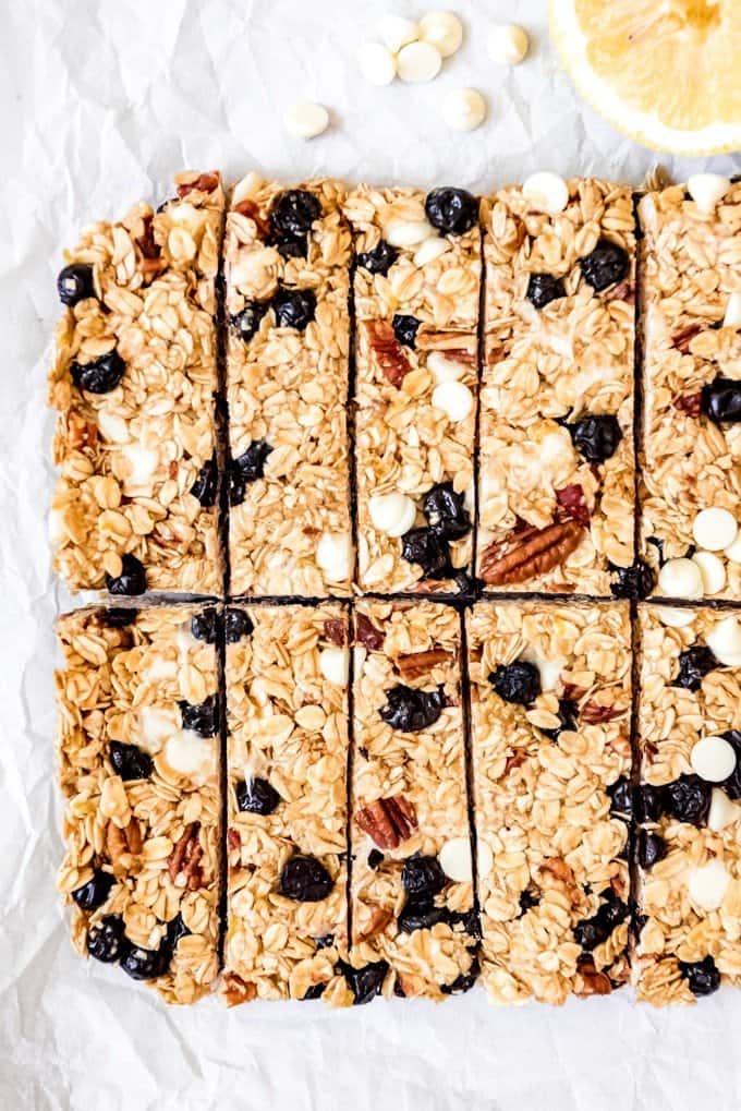 An image of a batch of lemon blueberry white chocolate granola bars that have just been cut into rectangles.
