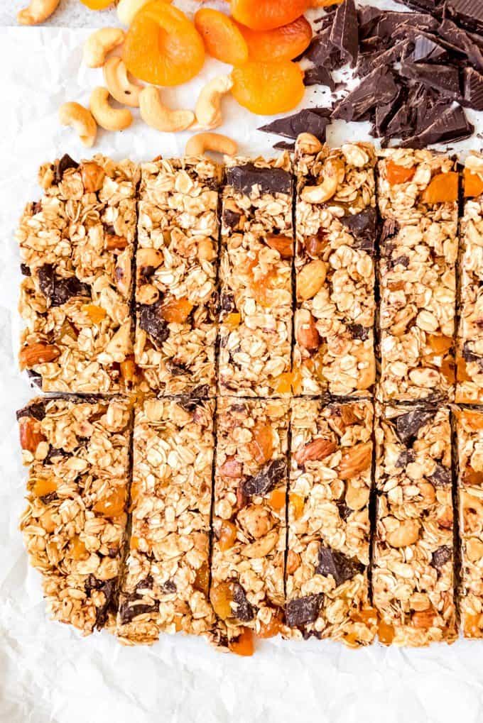An image of granola bars made with cashews, dried apricots, and dark chocolate.