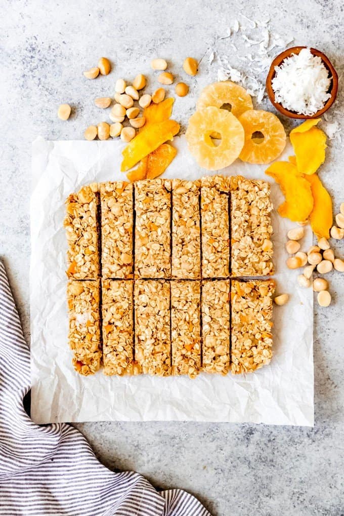 An image of a batch of tropical mango pineapple coconut granola bars that have just been sliced.