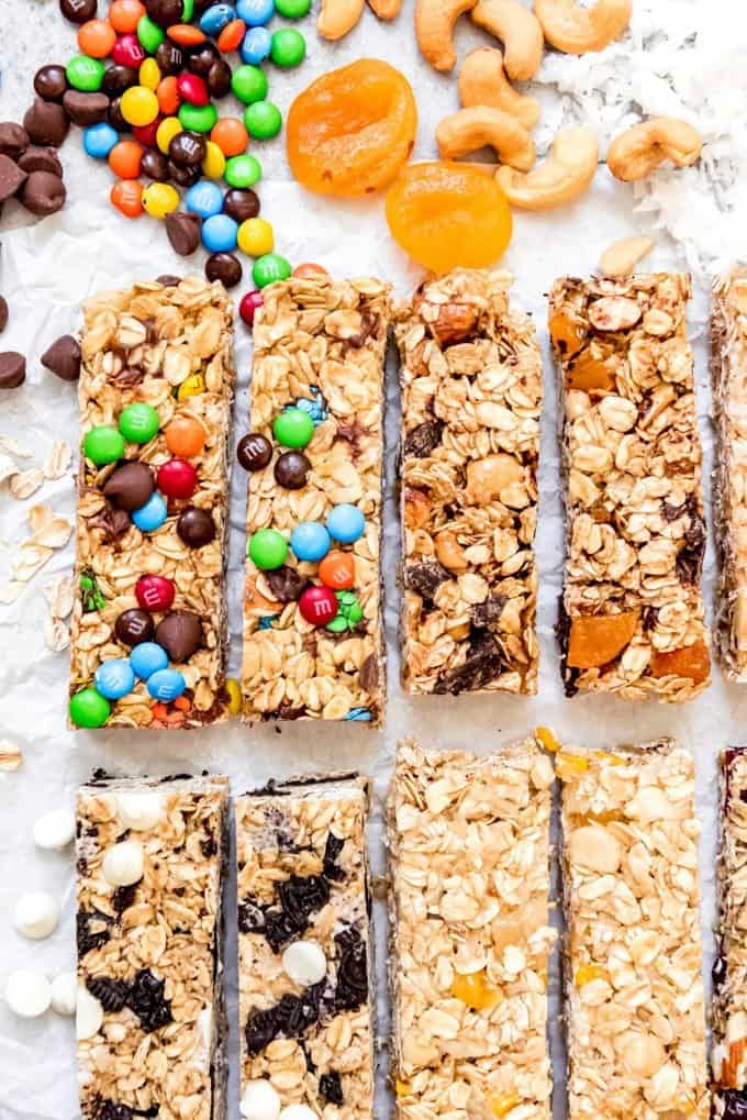 An image of four different types of homemade granola bar variations arranged side-by-side.