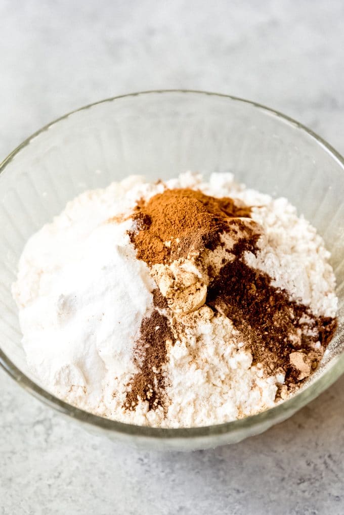 Combining flour and spices in a bowl.