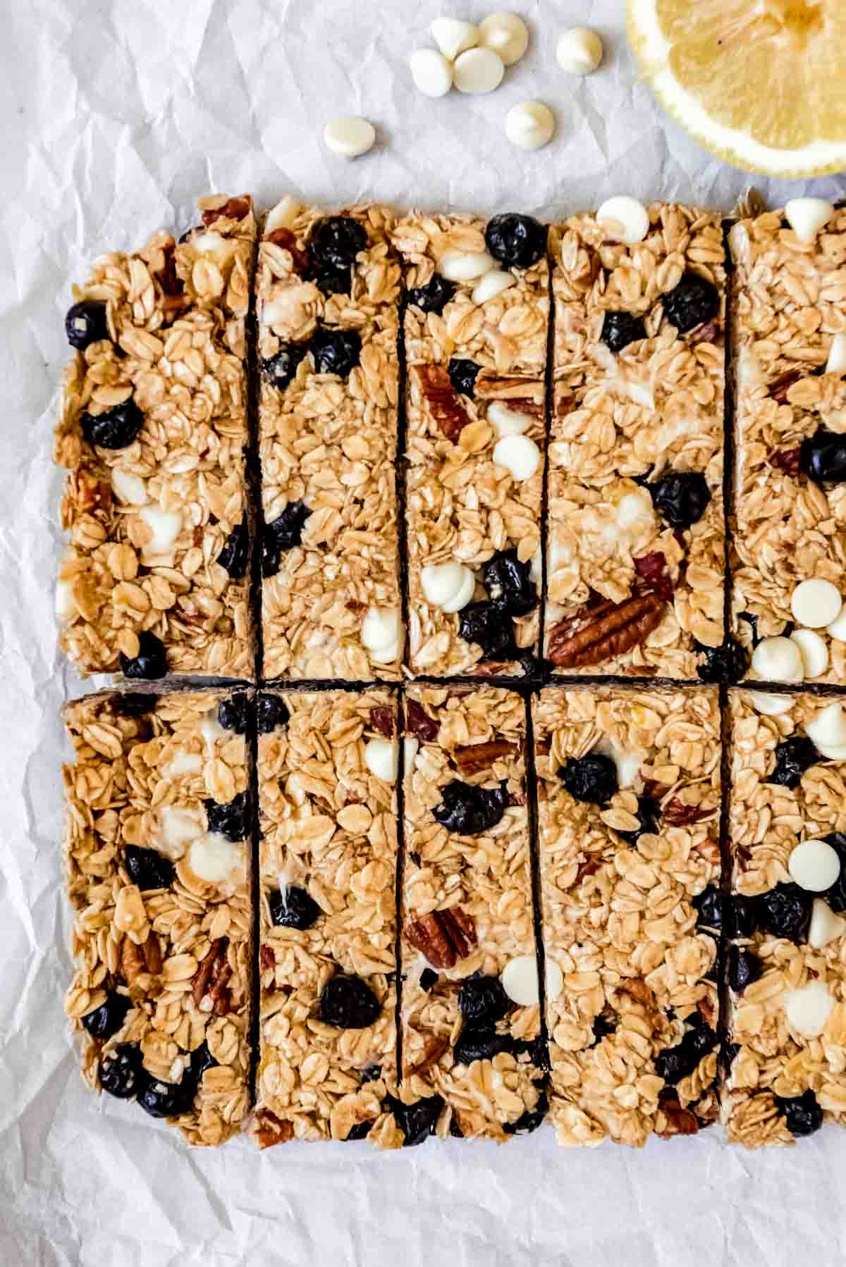 An image of a batch of lemon blueberry white chocolate granola bars that have just been cut into rectangles.