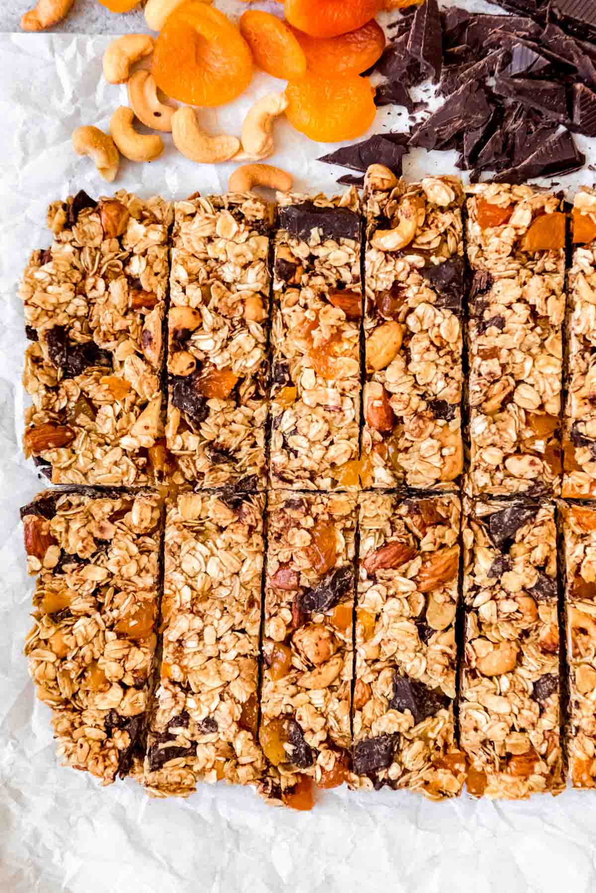 An image of granola bars made with cashews, dried apricots, and dark chocolate.