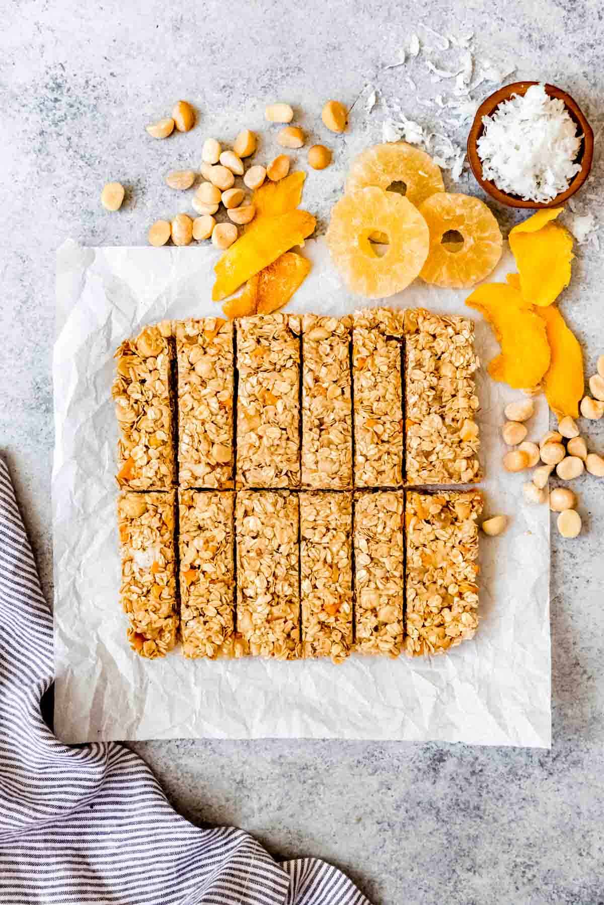 An image of a batch of tropical mango pineapple coconut granola bars that have just been sliced.