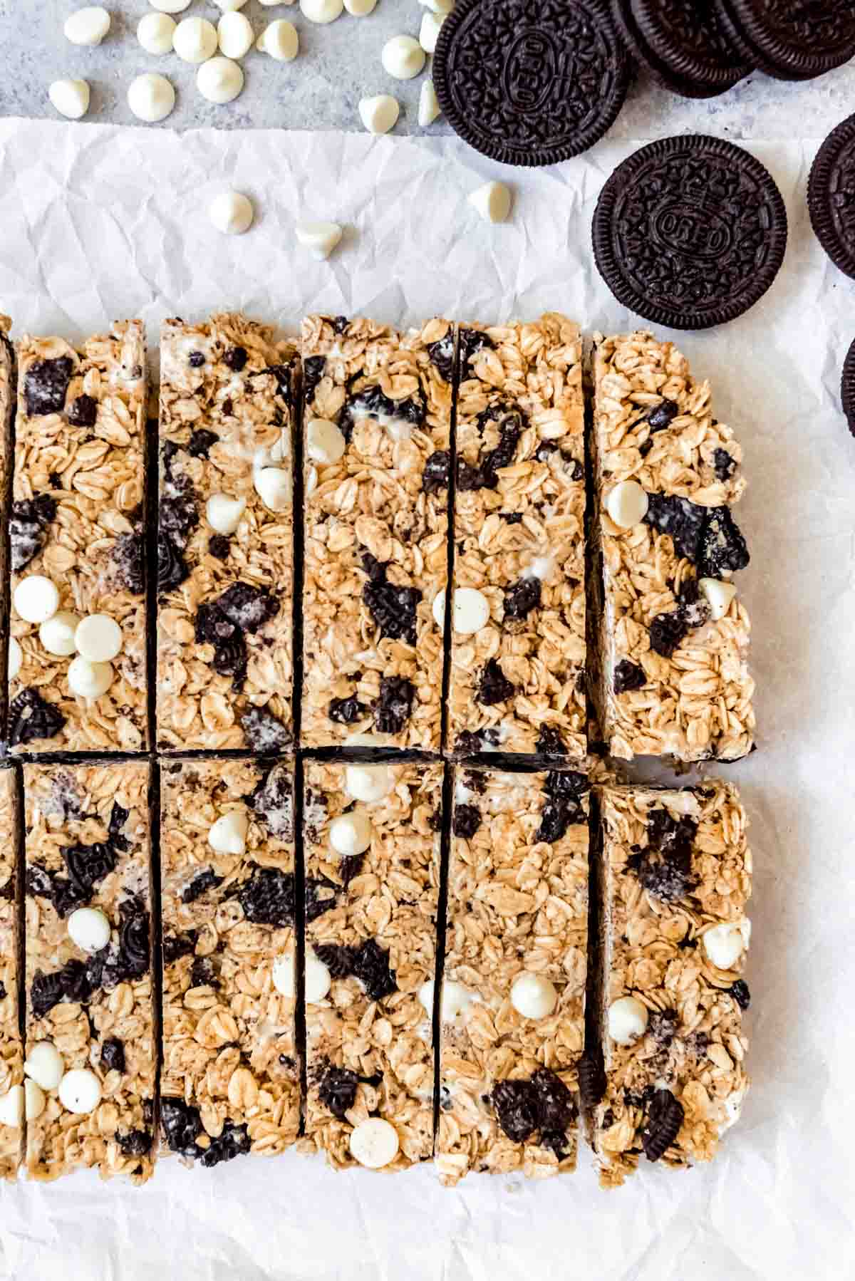 An image of homemade cookies & cream granola bars made with crushed Oreos and white chocolate chips.