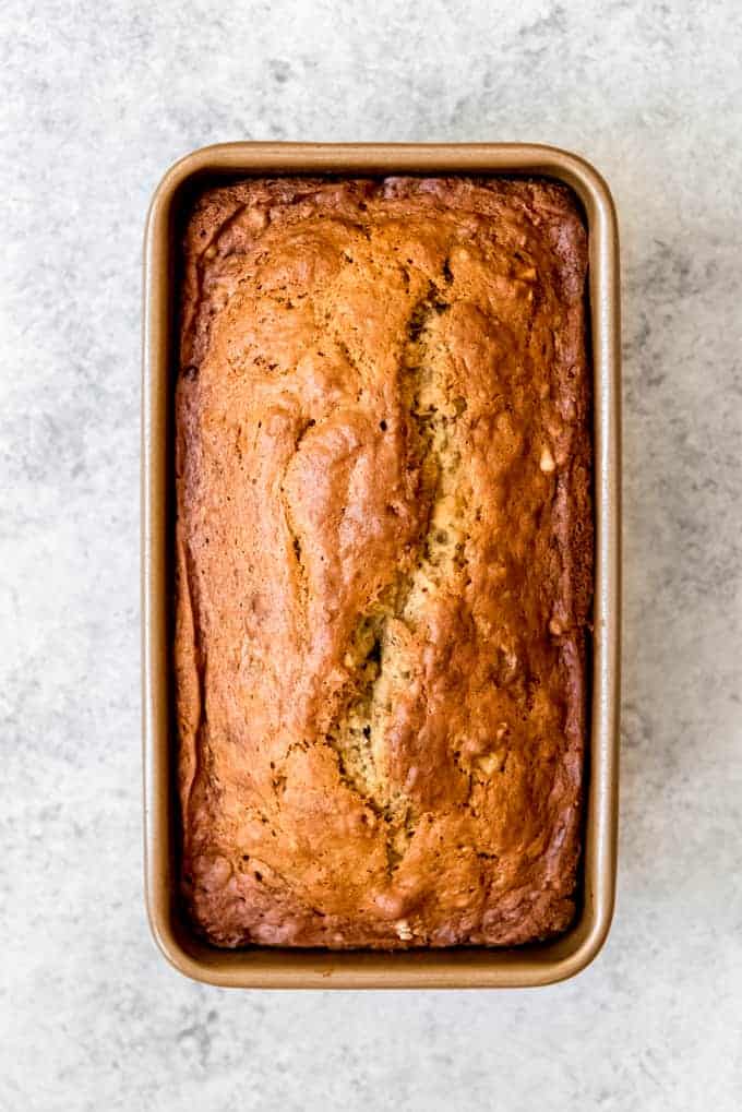 An image of fresh baked banana bread in a loaf pan.
