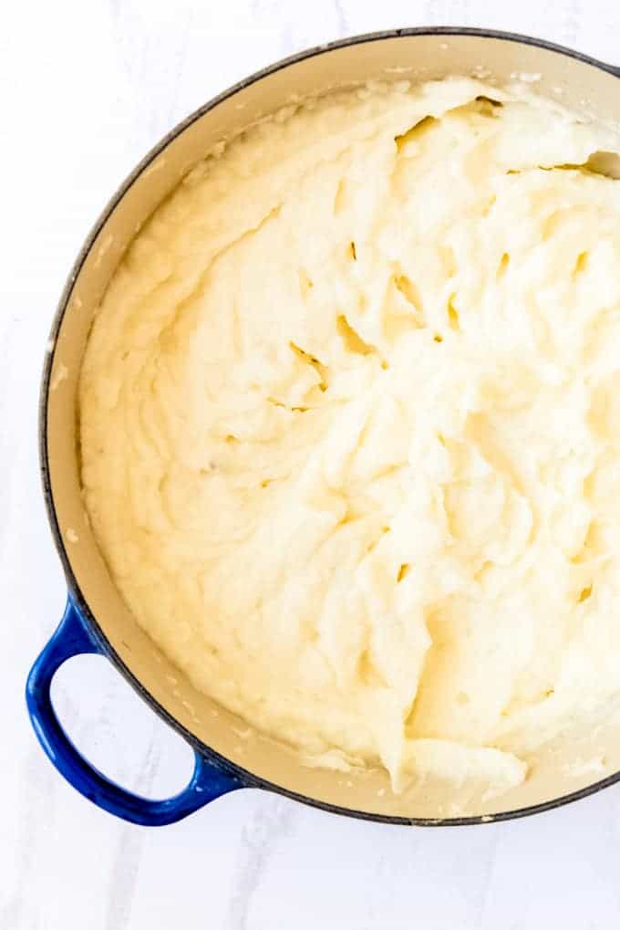 An image of a large pot of creamy whipped mashed potatoes.