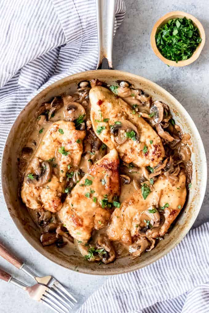 An image of a pan of creamy chicken marsala in a mushroom wine sauce.