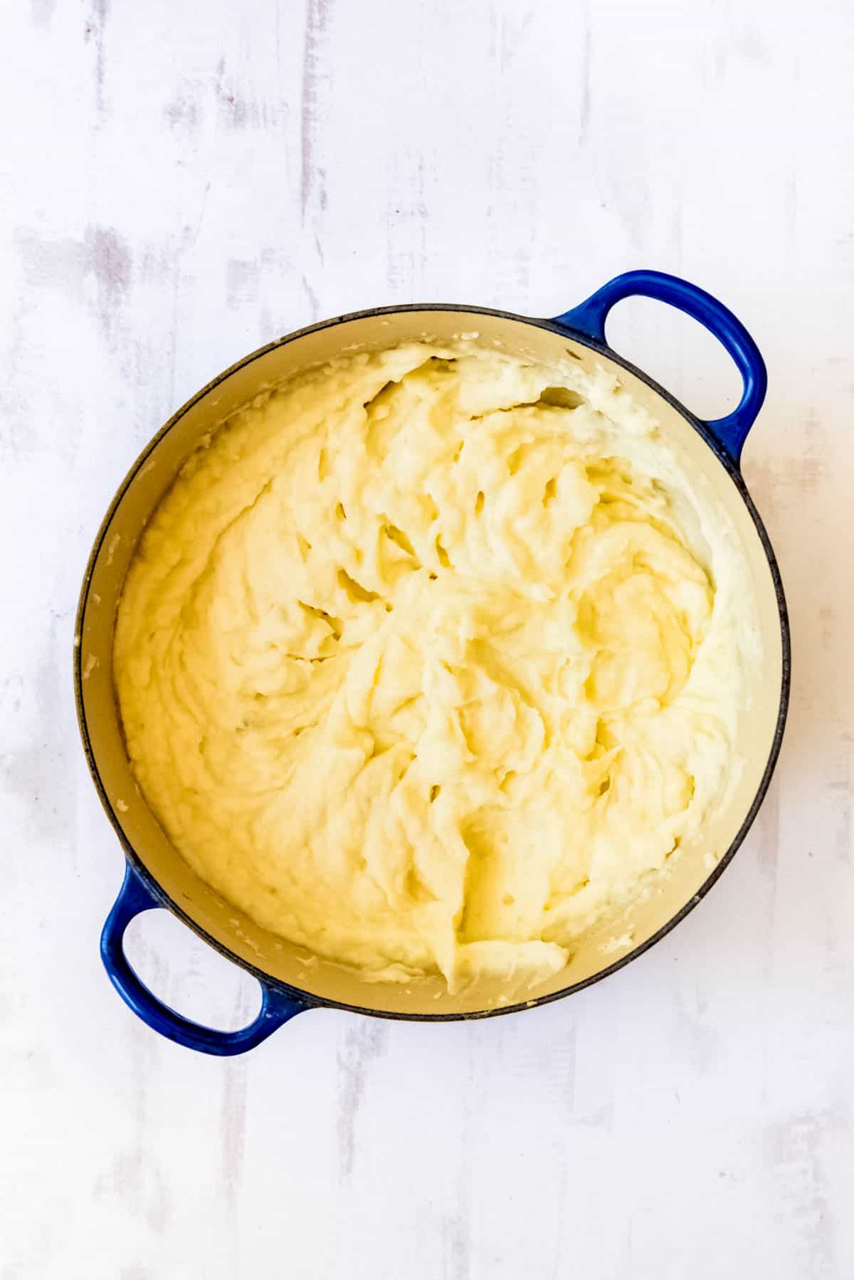 Creamy mashed potatoes in a large pot.