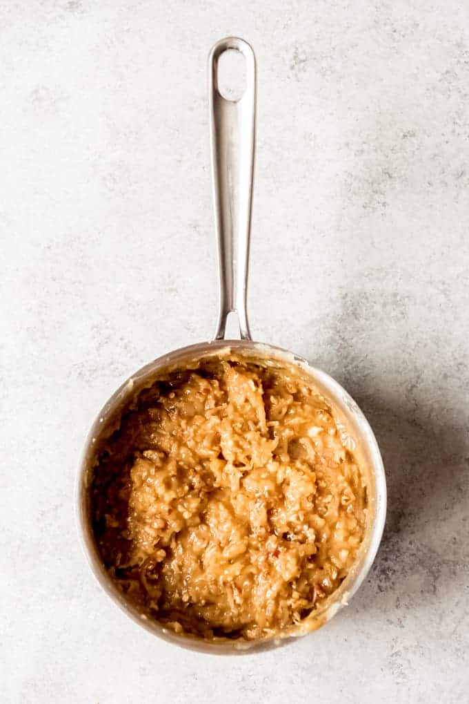 An image of a saucepan filled with homemade coconut pecan frosting for German chocolate cake.