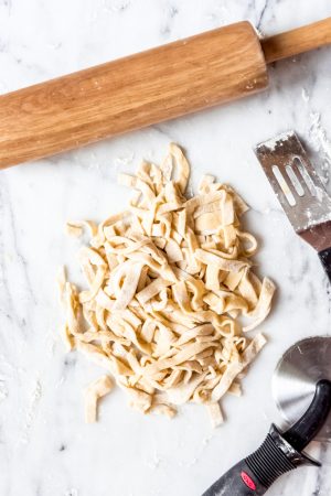 An image of a pile of homemade egg noodles.