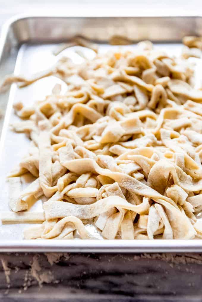 An image of fresh pasta on a baking sheet.