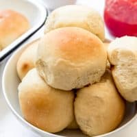 An image of homemade potato rolls in a bowl.