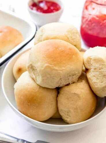 An image of homemade potato rolls in a bowl.