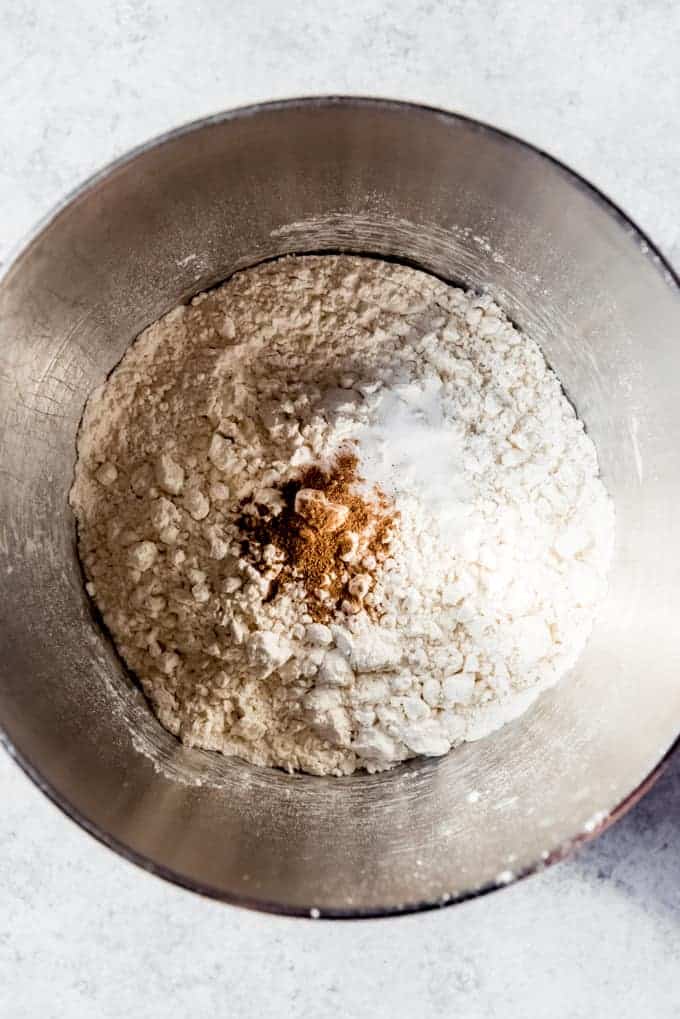 An image of a bowl with flour, nutmeg, and salt for making German noodles.
