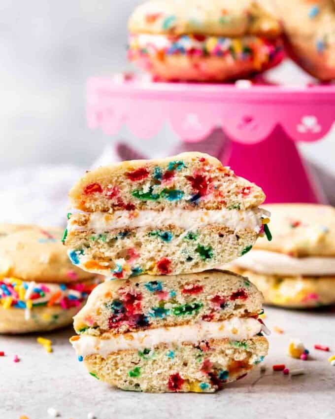 An image of a cross-section of a funfetti whoopie pie that has been cut in half to show the sprinkle interior.