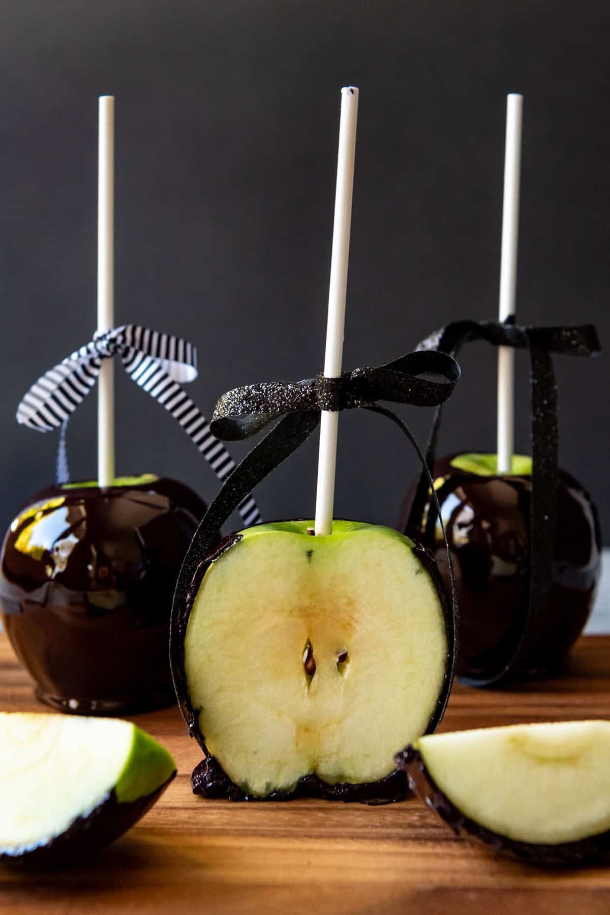 An image of Halloween candied apple sliced in half.