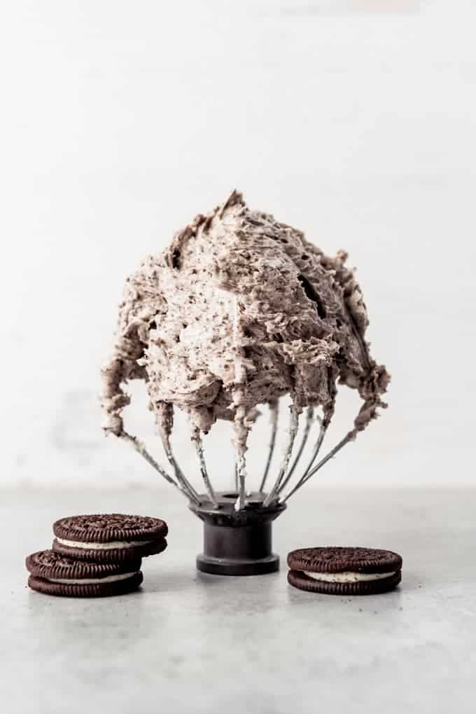 An image of a KitchenAid whisk attachment covered in Oreo frosting.