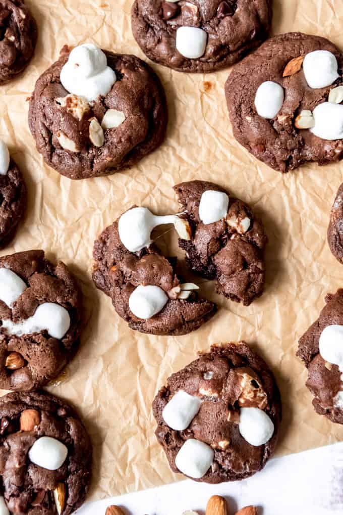 An image of melted marshmallows on top of chocolate cookies being pulled apart.