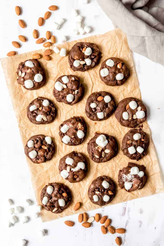 An image of chewy chocolate cookies with marshmallows and almonds.
