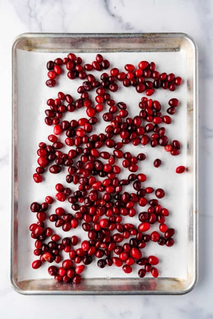 Sticky cranberries on a baking sheet.