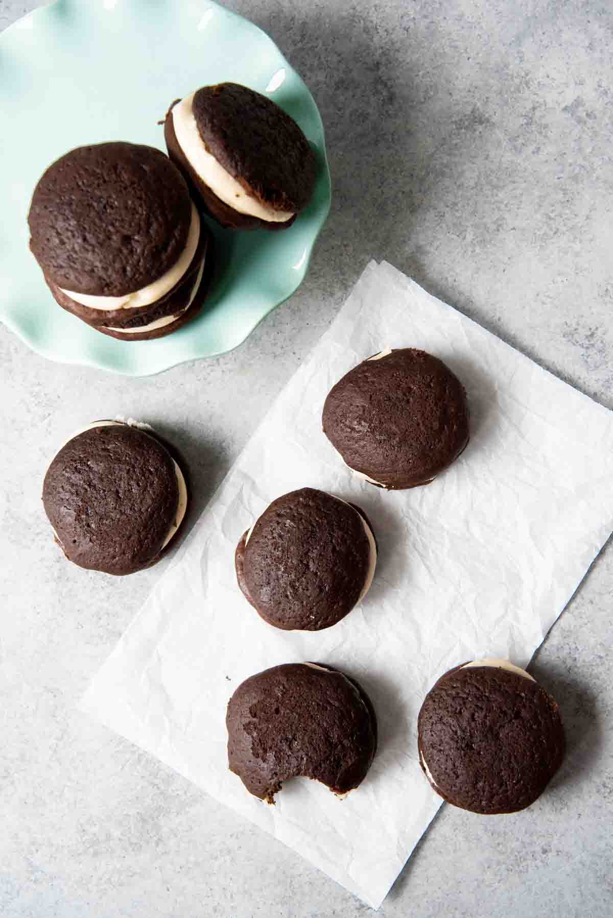 An image of chocolate whoopie pies filled with salted caramel buttercream frosting.