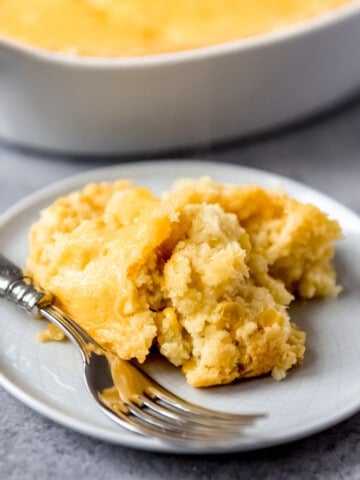 An image of a large scoop of corn casserole on a plate.