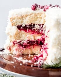 An image of a coconut cake filled with cranberry filling.