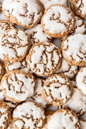 An image of iced oatmeal cookies stacked on each other.