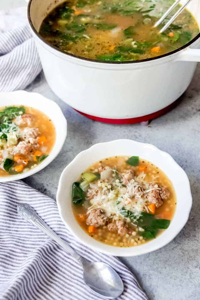 An image of bowls of Italian meatball soup.