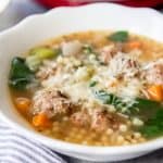 An image of a bowl of Italian Wedding Soup with homemade meatballs.