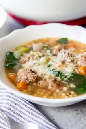 An image of a bowl of Italian Wedding Soup with homemade meatballs.