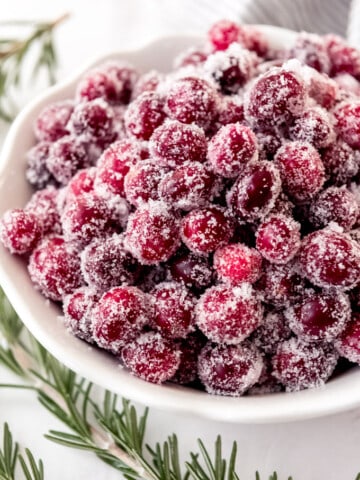 An image of sugared cranberries in a bowl.