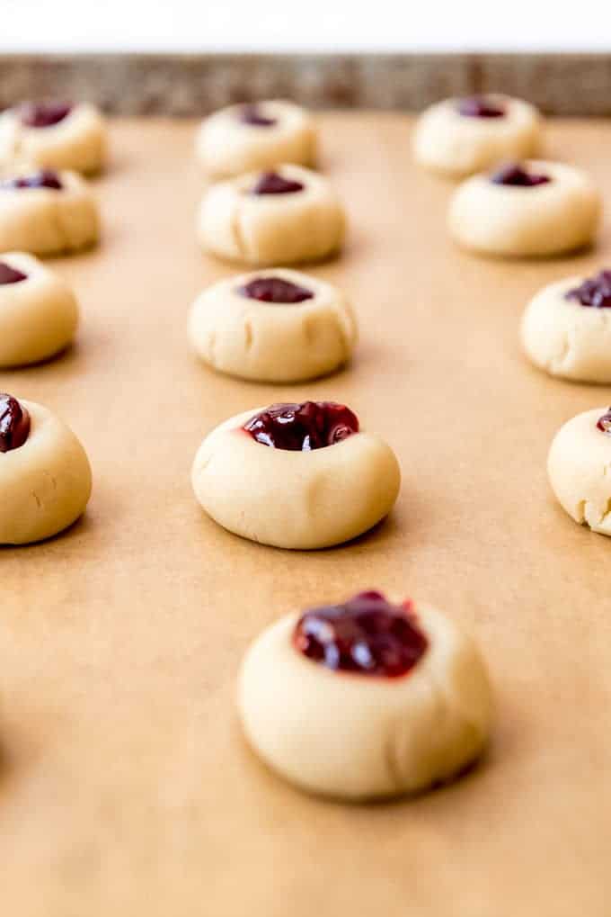 An image of shortbread cookie dough filled with raspberry jam.