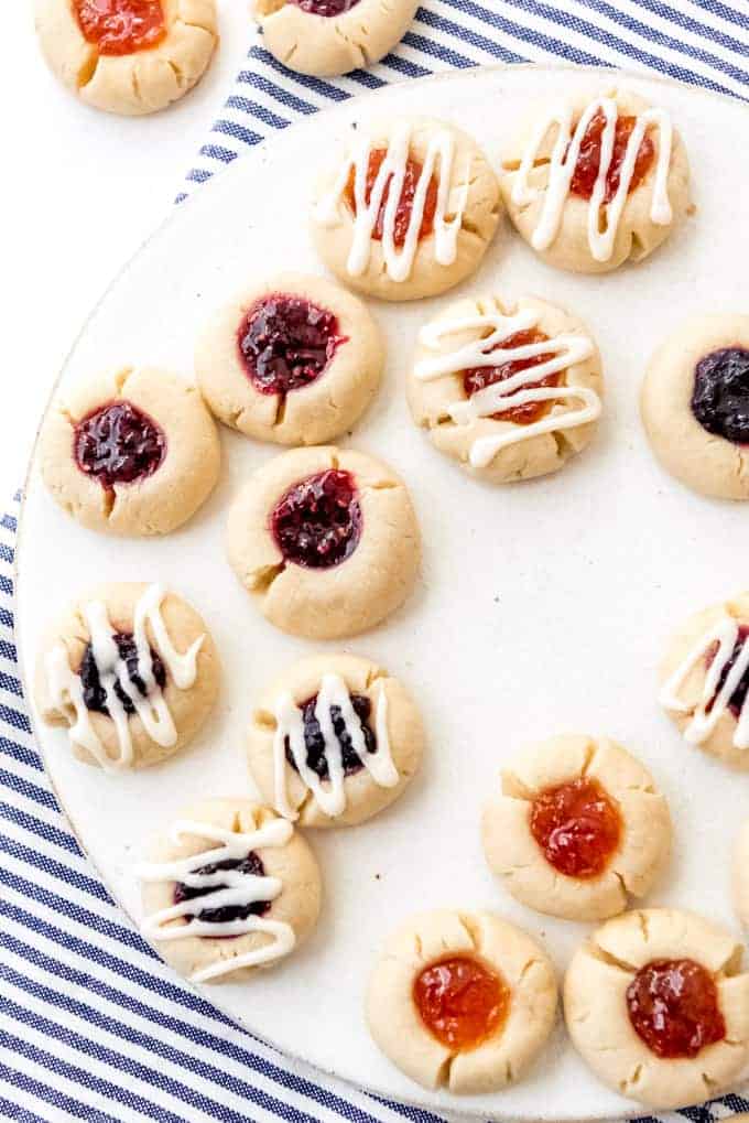 An image of jam-filled thumbprint cookies on a plate.