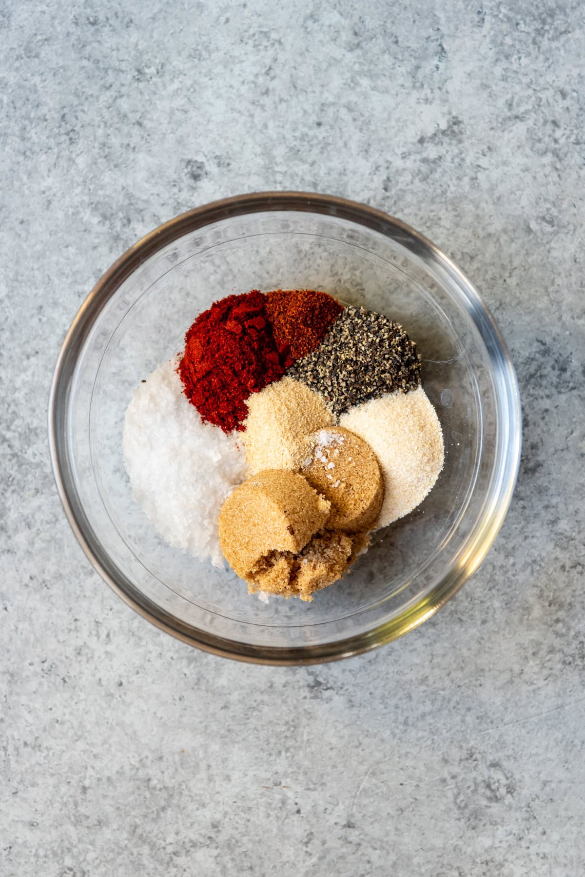 An image of spices and brown sugar in a bowl to create a turkey rub.