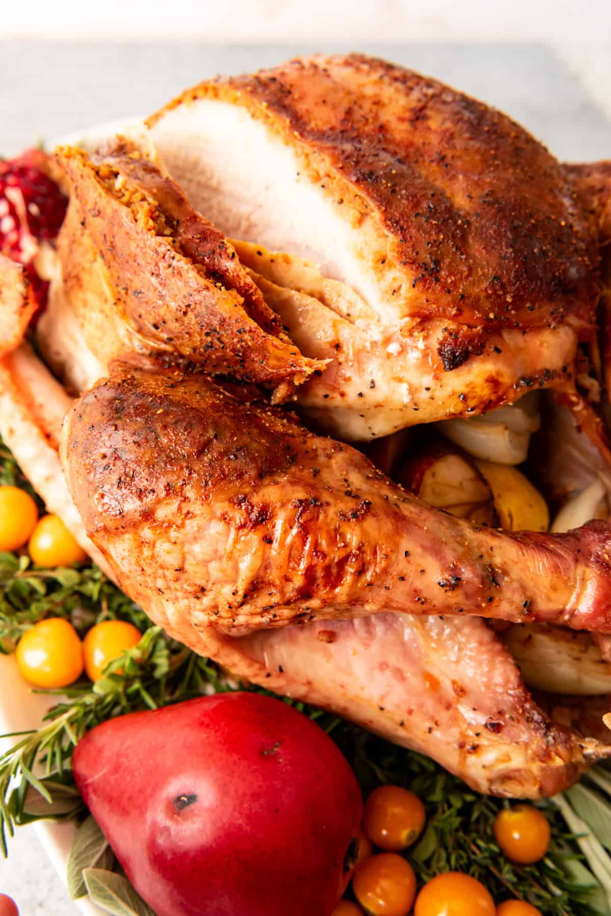 An image of a Thanksgiving turkey in the process of being carved.