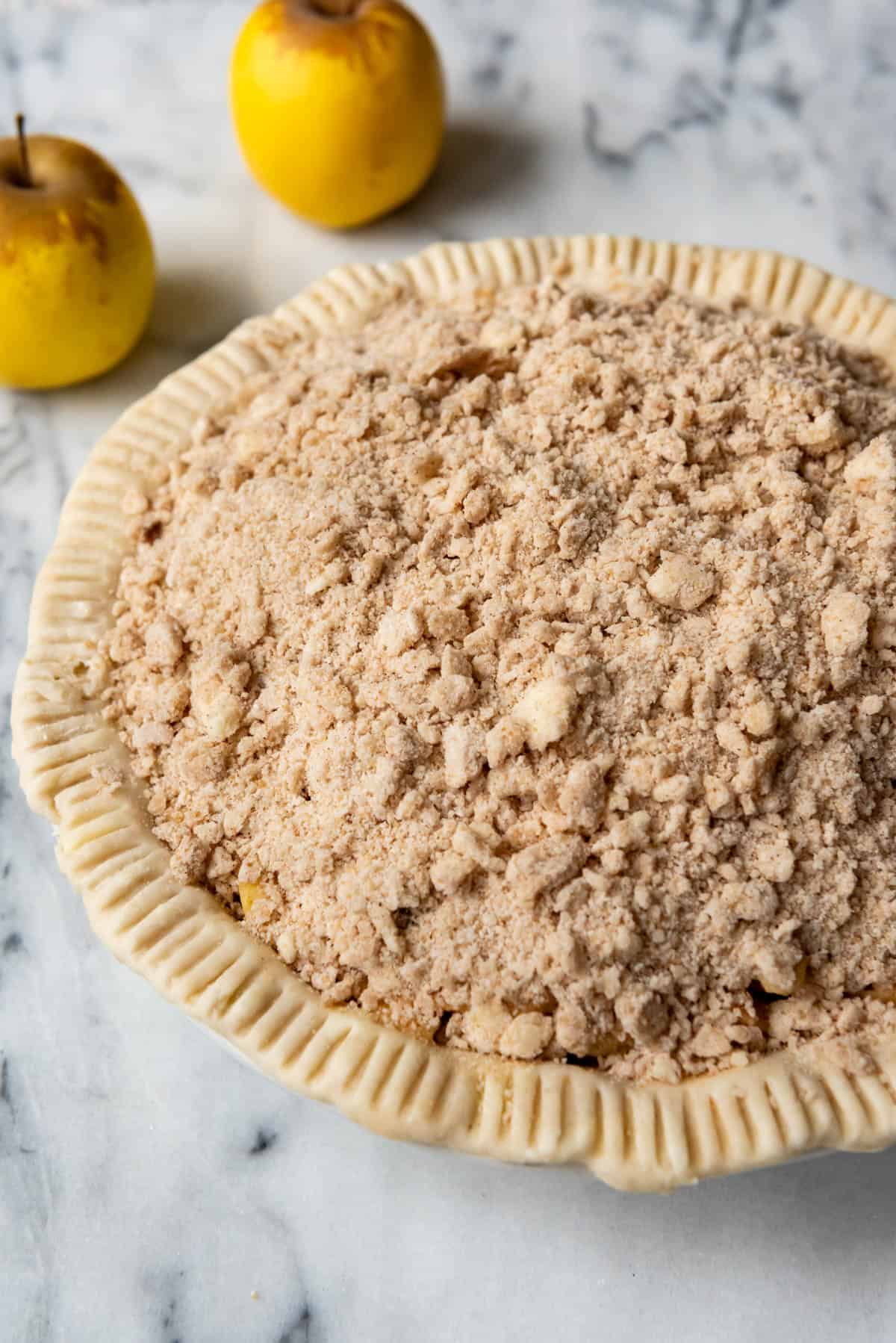 An image of a dutch apple pie before it has been baked.