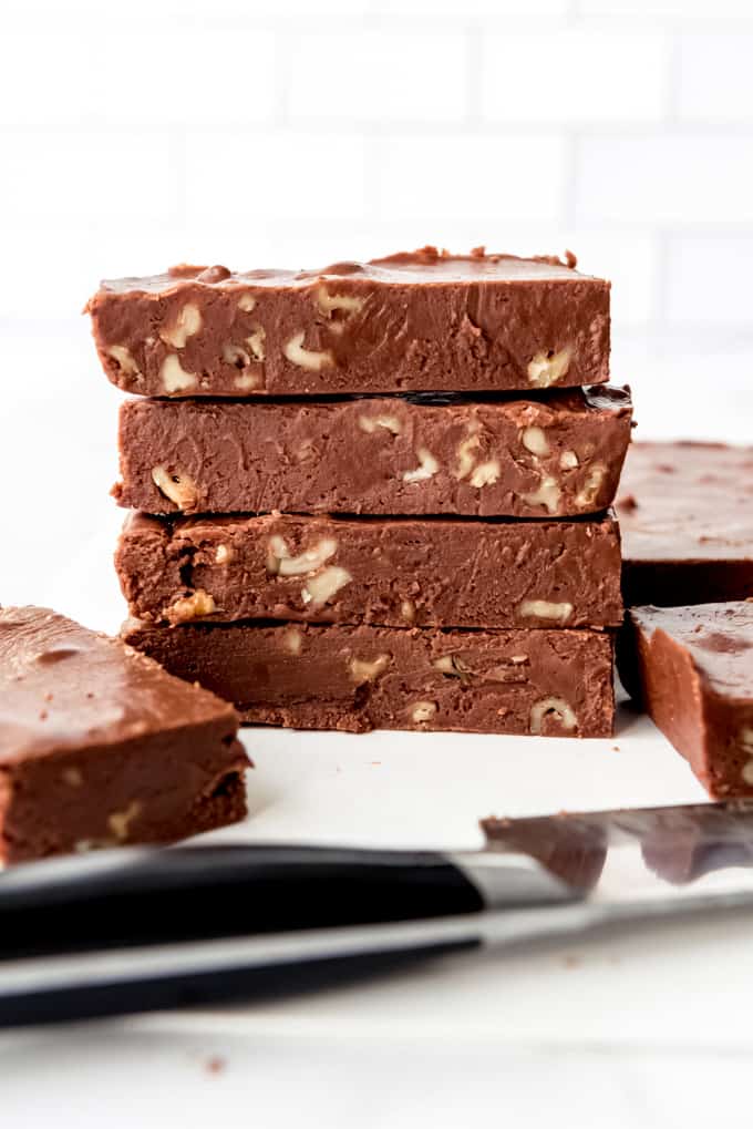 An image of blocks of chocolate walnut fudge stacked on top of each other.