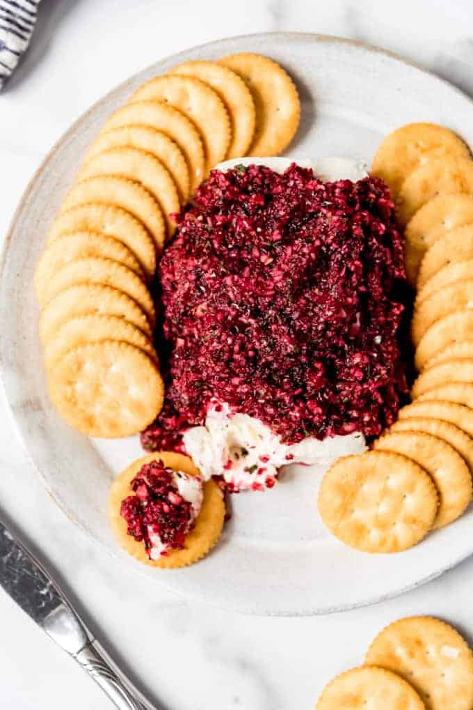 An image of a cracker spread with cream cheese and cranberry salsa.