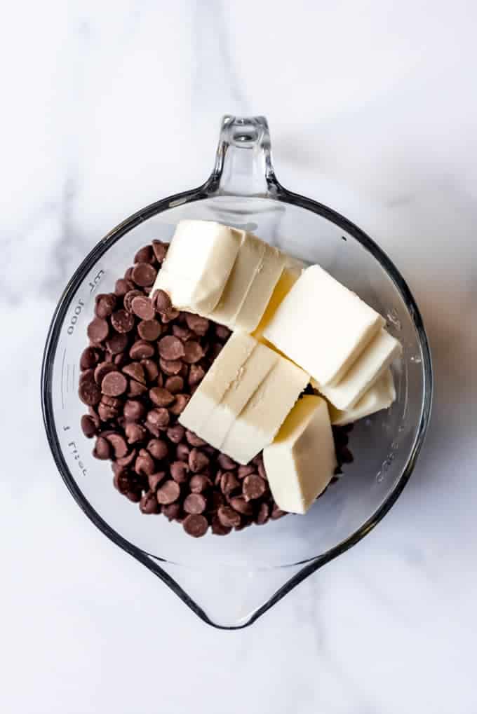 An image of chocolate chips and cubed butter in a bowl.