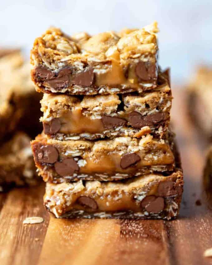 An image of carmelita bars with melted caramel stacked on top of each other.