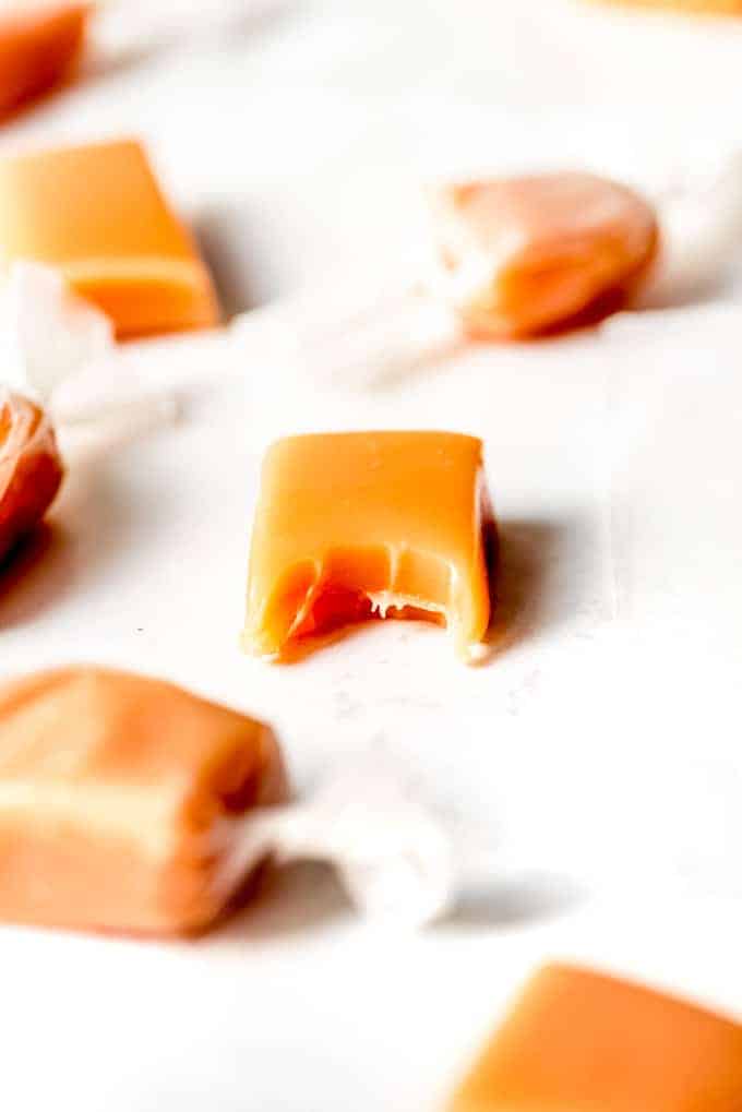 An image of a soft cream caramel with a bite taken out of it.