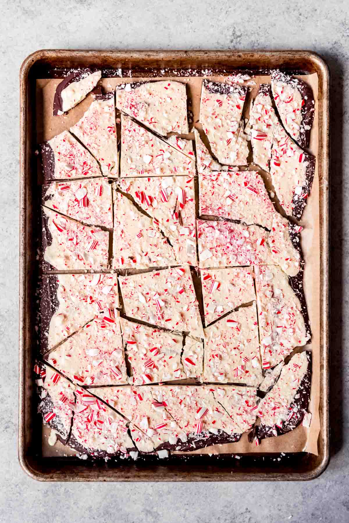 An image of a batch of homemade peppermint bark that has been broken into large chunks.