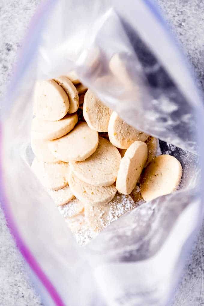 An image of slice-and-bake cookies in a resealable bag with powdered sugar for dusting.