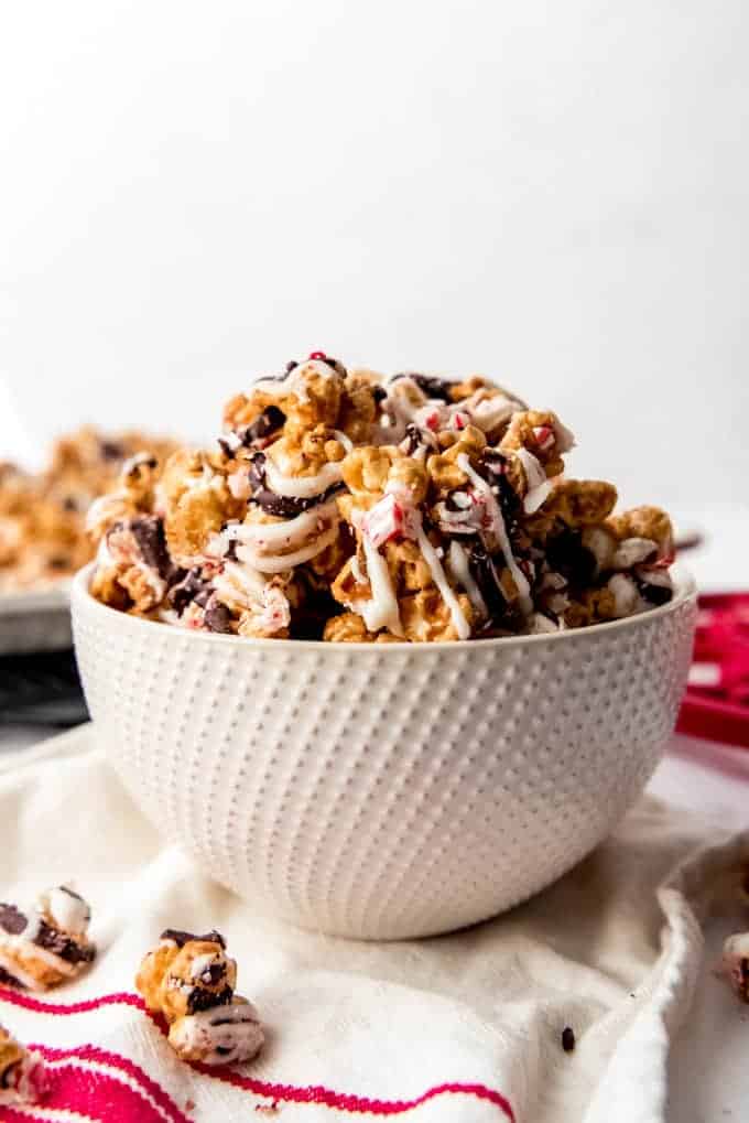 An image of a bowl filled with gourmet homemade popcorn drizzled in white and dark chocolate.