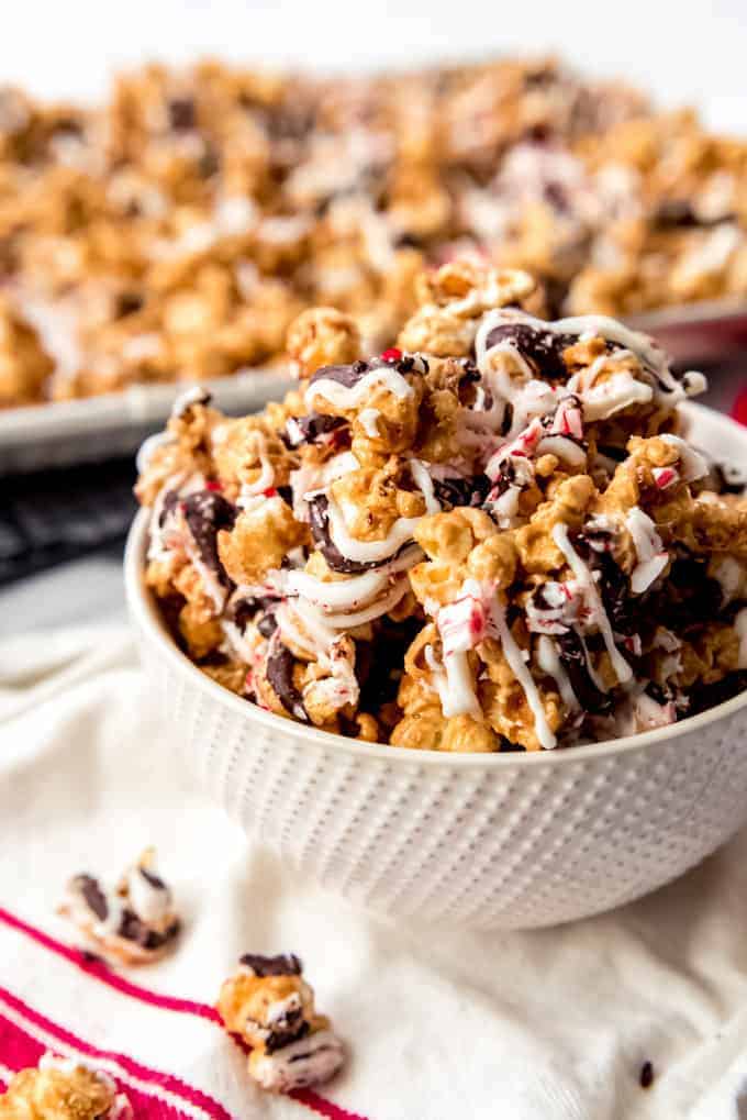 An image of a bowl of peppermint bark caramel popcorn.