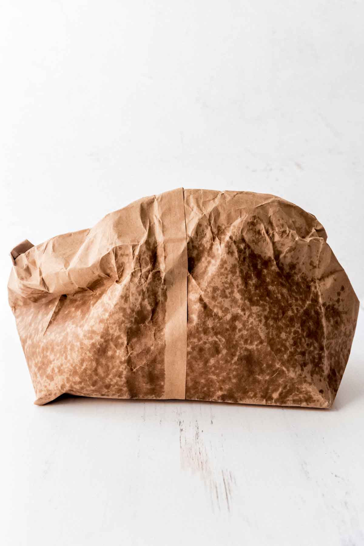 An image of a brown paper bag that has been used to cook popcorn in the microwave.