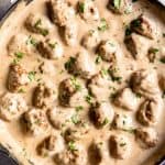 An image of homemade Swedish meatballs in a creamy gravy.