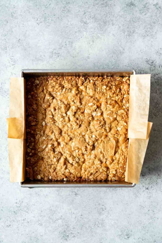 Baked carmelitas bars in a square pan.